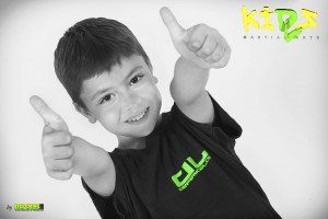 young boy two thumbs up for kidz martial arts